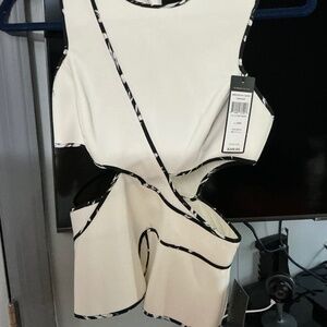 Bcbg peplum off white cut out peplum sleeveless top.
